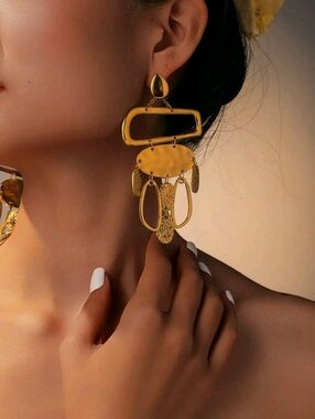 Assymetrical dangling gold statement earrings; nwot
